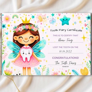 May include: A pink and blue tooth fairy certificate with a cartoon tooth fairy holding a tooth. The certificate reads "Tooth Fairy Certificate" and "This is to certify that Drew Feig lost the tooth on the 06.04.2022. Congratulations! The Tooth Fairy."