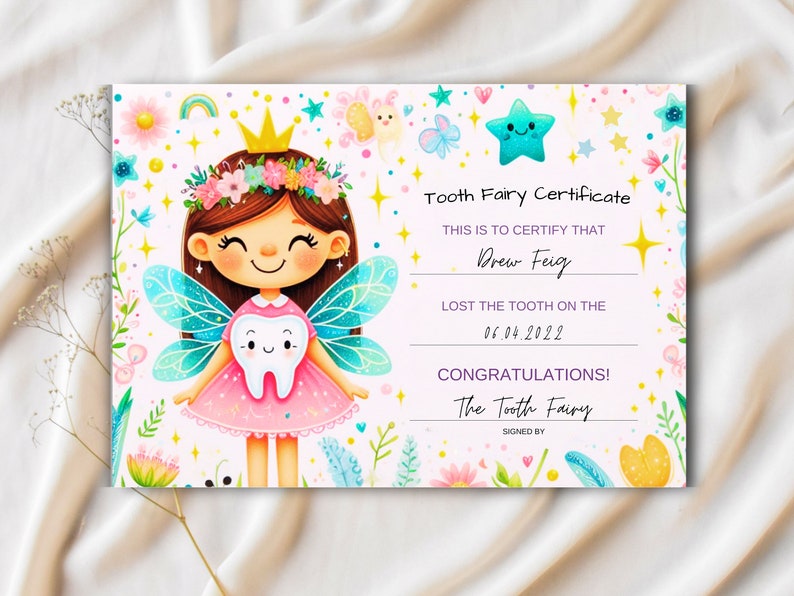 May include: A pink and blue tooth fairy certificate with a cartoon tooth fairy holding a tooth. The certificate reads "Tooth Fairy Certificate" and "This is to certify that Drew Feig lost the tooth on the 06.04.2022. Congratulations! The Tooth Fairy."