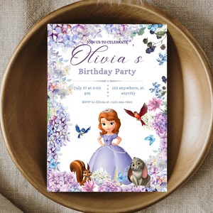 May include: A purple and white birthday party invitation featuring a cartoon princess with a crown and a purple dress. The invitation has a floral border with purple, pink, and blue flowers. The text on the invitation reads "Join us to celebrate Olivia's Birthday Party" and includes the date, time, and location of the party.