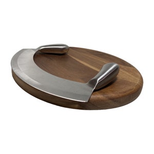 May include: A wooden cutting board with a curved stainless steel knife with two handles. The knife is designed for slicing cheese.