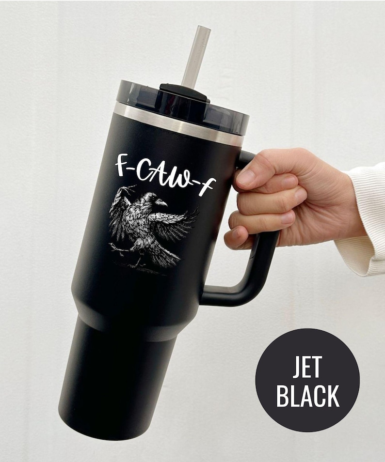 A stainless steel insulated tumbler featuring a detailed black raven illustration with wings spread, paired with the phrase "F-Caw-F" in playful script; the design blends gothic and humorous elements, creating a unique travel cup for bird enthusiasts, crow lovers, or fans of dark sarcastic quotes; shown on tumblers in various matte finishes, each with a handle and straw for practical everyday use.