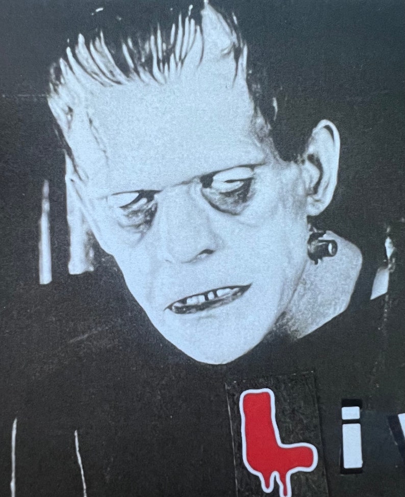 May include: Black and white image of Frankenstein's monster with a red sticker that says "L" on his chest. The sticker is dripping red paint.