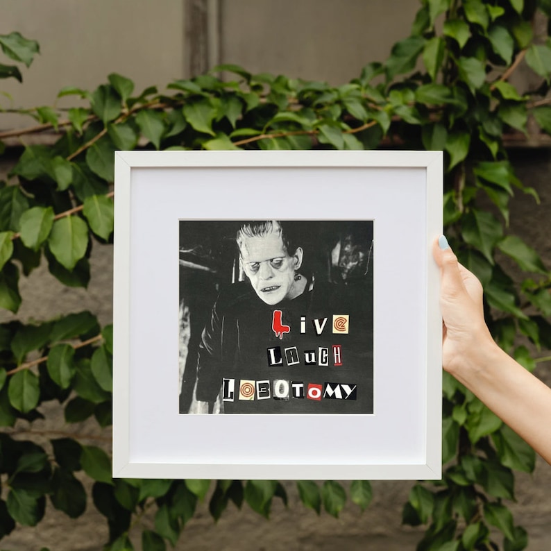 May include: A black and white framed print of a man with a Frankenstein-like appearance. The print features the text "Live Laugh Loeotomy" in a collage style.