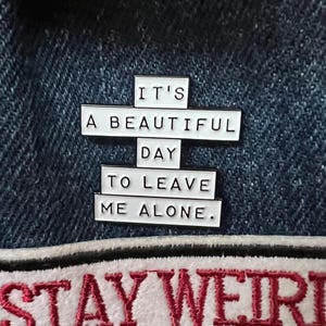 this is a perfect soft enamel pin for introverts and people who hate people. "it's a beautiful day to leave me alone." funny punk pins.