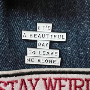 this is a perfect soft enamel pin for introverts and people who hate people. "it's a beautiful day to leave me alone." funny punk pins.