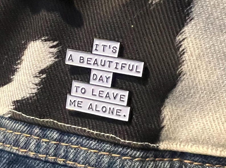 this is a perfect soft enamel pin for introverts and people who hate people. "it's a beautiful day to leave me alone." funny punk pins.