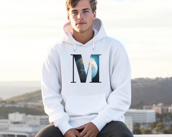 May include: White hooded sweatshirt with a large black letter "M" printed on the front. The letter "M" is filled with a blue and white image of a planet.