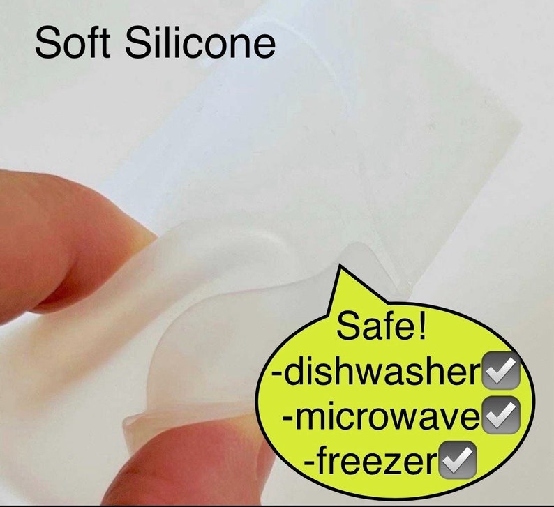 May include: A close-up of a clear silicone mold, showing its flexibility. The mold is labeled "Safe!" with checkmarks next to "dishwasher", "microwave", and "freezer".
