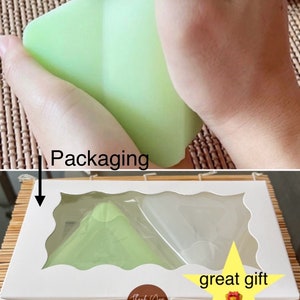 May include: A white box with a clear window showing two green silicone molds shaped like pyramids. The box has a "Thank You" sticker and a yellow star with the text "great gift".