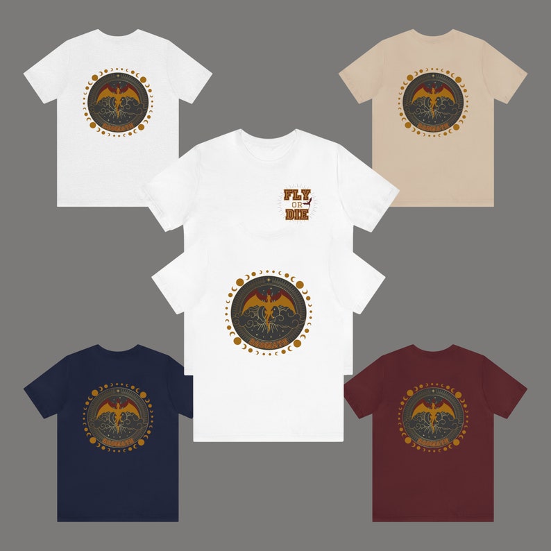 May include: A collection of short-sleeved t-shirts in white, beige, navy blue, and burgundy. Each shirt features a circular design with a phoenix, clouds, and moon phases. One shirt has "FLY OR DIE" text.