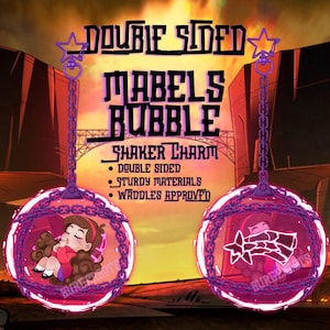 Könnte beinhalten: Ein doppelseitiger "Mabel's Bubble" Shaker-Charm. Der Charm hat ein rosa Blasendesign mit einer Kette und Sternendetails. Eine Seite zeigt Mabel Pines, die andere Seite ein Sterndesign. Der Text lautet "Doppelseitig", "Strapazierfähige Materialien" und "Waddles Approved".