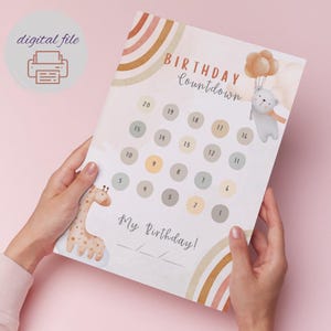 May include: A printable birthday countdown chart with a rainbow design. The chart features a giraffe, a bear, and balloons. The numbers 1 through 20 are displayed in circles. The text "Birthday Countdown" and "My Birthday!" are also included.