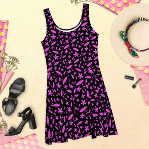 Skater dress with flower and leaf print. Black dress with pink flowers. Floral dress. Spring skater dress.