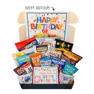 May include: A gift box filled with various snacks, including chips, cookies, and popcorn. The box features a colorful "Happy Birthday" design on the inside and a card that says "Poppin' by to say Happy Birthday!"