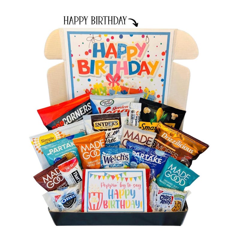 May include: A gift box filled with various snacks, including chips, cookies, and popcorn. The box features a colorful "Happy Birthday" design on the inside and a card that says "Poppin' by to say Happy Birthday!"