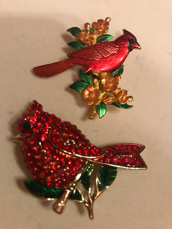 Pair of cardinal brooch"s