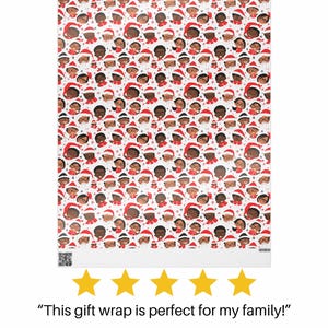 May include: White wrapping paper with a repeating pattern of cartoon faces wearing Santa hats and glasses. The faces are brown and the hats are red.