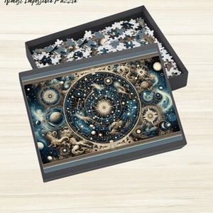 May include: A completed jigsaw puzzle in a black box. The puzzle depicts a vintage illustration of a celestial map with stars, planets, and constellations in shades of blue, gold, and white.