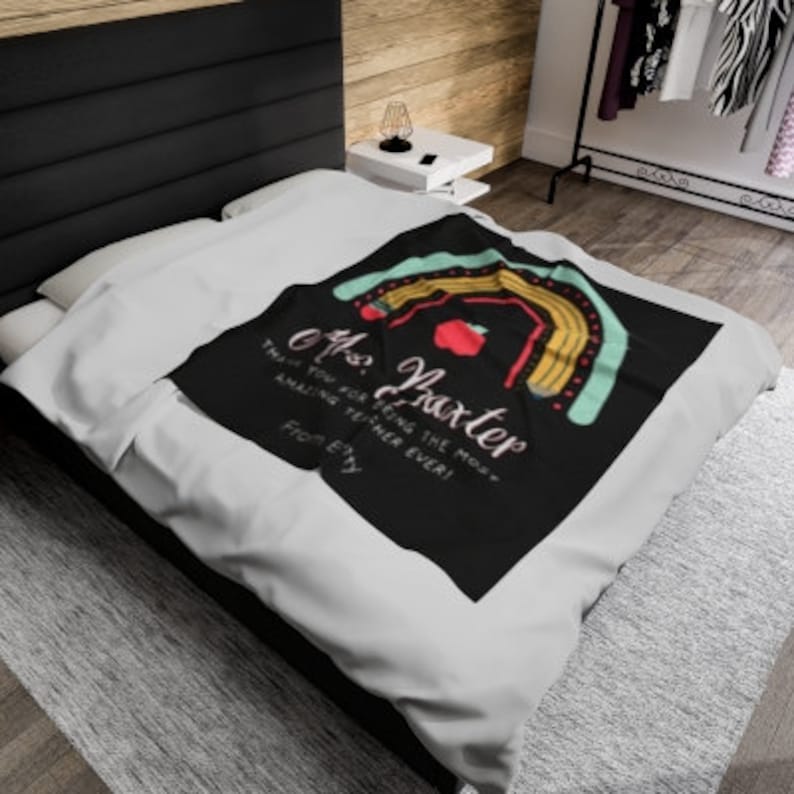 May include: A black and white teacher appreciation blanket with a rainbow design and the text "Thank you for being the most amazing teacher ever! From [Name]"