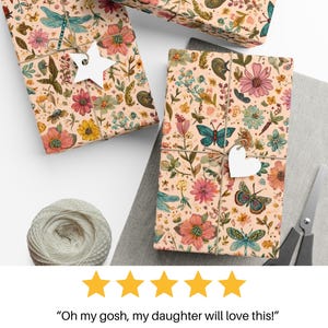 May include: Gift-wrapped boxes with floral and butterfly patterns, tied with twine and adorned with star and heart-shaped tags. A spool of twine and scissors are also visible. The text "Oh my gosh, my daughter will love this!" is displayed below.