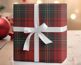 May include: A red and black plaid gift box with a white ribbon. The box is wrapped in a festive plaid pattern and tied with a simple white bow.