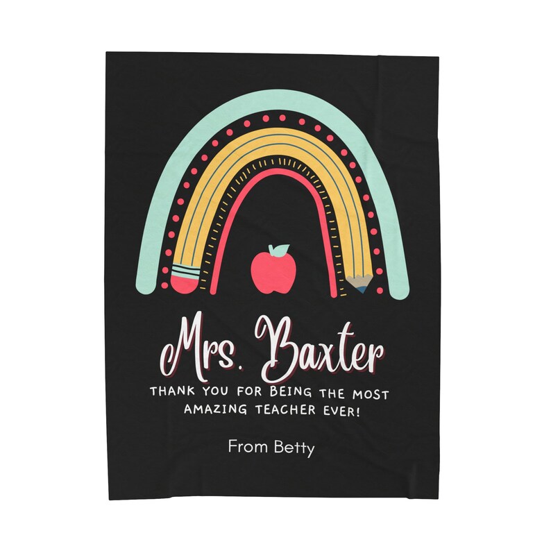 May include: A black and white teacher appreciation blanket with a rainbow made of pencils and a red apple. The text reads "Mrs. Baxter Thank you for being the most amazing teacher ever! From Betty."