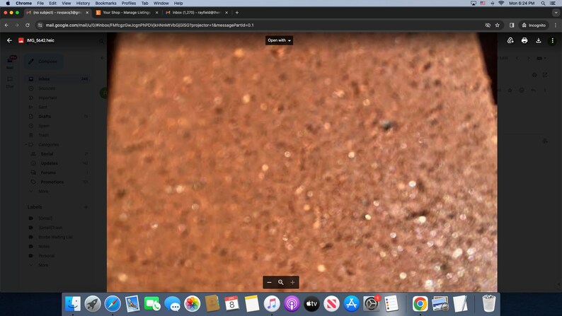 May include: Close-up image of a brown, textured surface with small, round, light-colored spots. The surface appears to be made of a natural material, such as wood or stone.