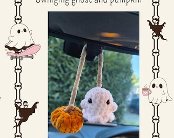 May include: A handmade Halloween car charm featuring a plush white ghost and an orange pumpkin. The ghost and pumpkin are suspended from a car mirror. The text "Swinging ghost and pumpkin" is above the charm.