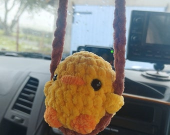 Retro swinging crochet decoration. chick duck white duck