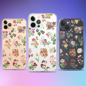 May include: Three clear phone cases with floral designs. The cases feature a variety of flowers in shades of red, pink, yellow, and white, with green leaves. The background colors of the cases are peach, clear, and black.