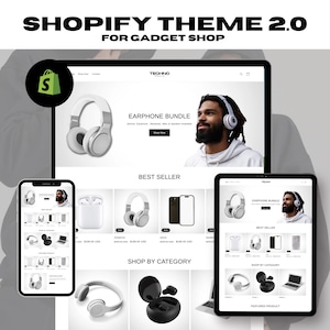 Może przedstawiać: Motyw Shopify dla sklepów z gadżetami, prezentujący makietę strony internetowej z białym tłem i wyświetlaczem produktów, w tym słuchawek, słuchawek dousznych i smartfona. Strona internetowa ma nagłówek z tekstem "TECHNO" i pasek nawigacyjny z opcjami "Kup teraz", "Kontakt" i pasek wyszukiwania. Strona internetowa ma również sekcję dla produktów "Najlepiej sprzedających się" i sekcję dla "Sklep według kategorii".