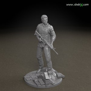 May include: A gray 3D printed figurine of a man holding a rifle. The figurine is standing on a base with a broken concrete texture.