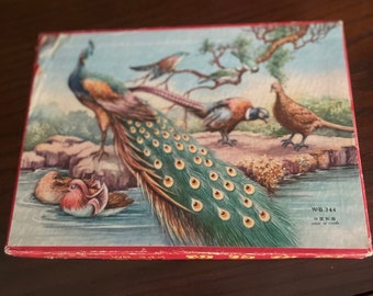 Two Vintage wooden peacock and lion puzzle in box.