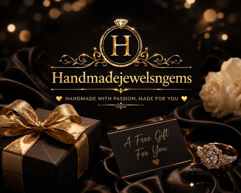 May include: Elegant image featuring a black gift box with a gold ribbon, a diamond ring, and a card that reads "A Free Gift For You." The logo "Handmadejewelsngems" is displayed in gold, with a diamond accent. The background is a dark, luxurious fabric.