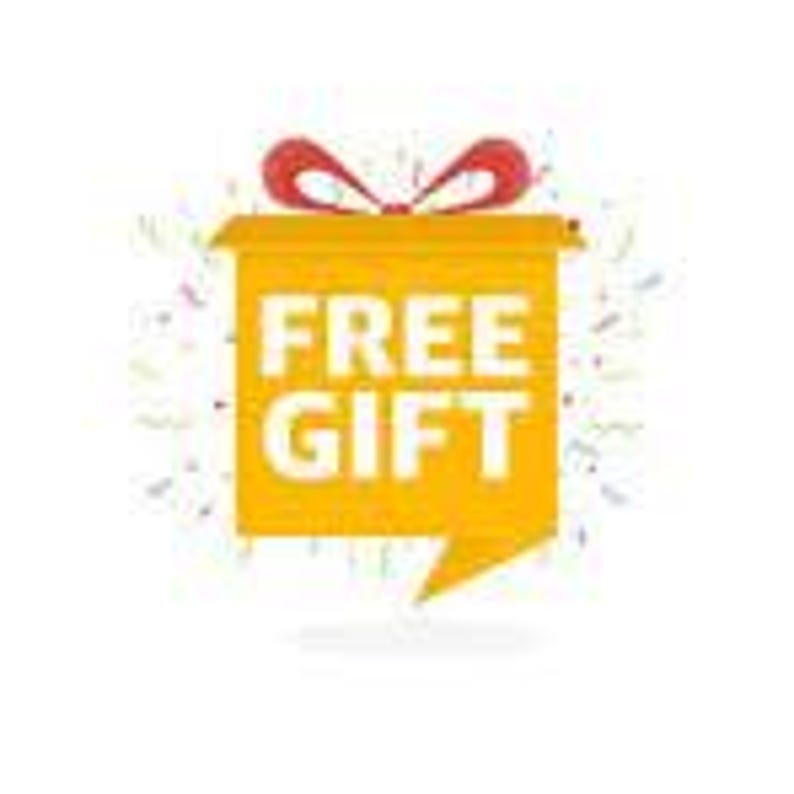 May include: A yellow gift box with a red bow on top and the words "FREE GIFT" in bold white letters. The box is surrounded by colorful confetti against a white background.