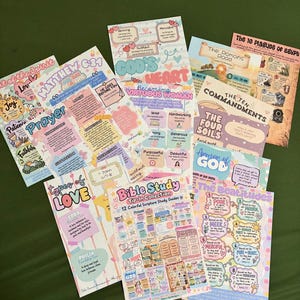 May include: A collection of twelve colorful Bible study tip-in guides featuring various religious themes, including The Ten Commandments, The Beatitudes, Armor of God, Types of Love, and Matthew 6:34, all printed on paper with pastel illustrations.
