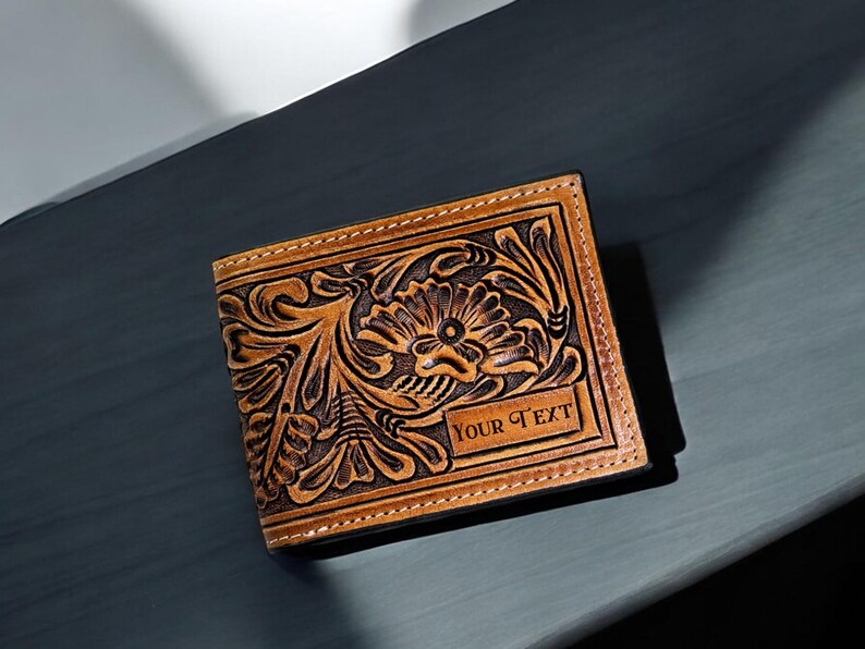 May include: A brown leather wallet with a floral design and the text 'YOUR TEXT' embossed on the front.
