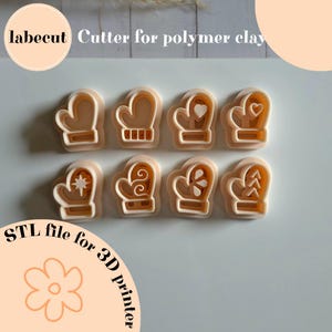 May include: Eight beige polymer clay mitten cutters with various designs, including hearts, stars, and decorative patterns. The image includes text that reads "labecut Cutter for polymer clay" and "STL file for 3D printer."