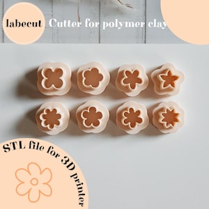 May include: Eight beige polymer clay cutters in various flower shapes. The cutters are arranged in two rows of four. The image includes text that reads "labecut Cutter for polymer clay" and "STL file for 3D printer".