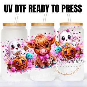 May include: Three glass tumblers with bamboo lids and straws. Each tumbler features a colorful Halloween-themed design, including a ghost, a pumpkin, and a Highland cow. The text "UV DTF READY TO PRESS" is at the top.