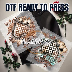 May include: A digital transfer design featuring a checkered spade with floral accents and playing cards. The design is ready to be pressed onto a shirt or other fabric.