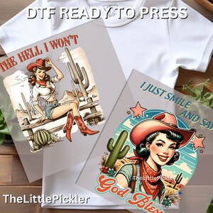May include: Two digital transfer designs featuring a vintage style illustration of a woman in a cowboy hat and bandana. The first design says "The Hell I Won't" and the second design says "I Just Smile And Say God Bless".