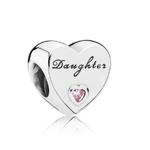 May include: Silver heart charm with the word "Daughter" engraved on it and a pink crystal heart in the centre.