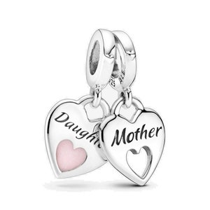 May include: Silver charm featuring two interlocking hearts. One heart is engraved with "Daughter" and has a pink enamel centre. The other heart is engraved with "Mother".