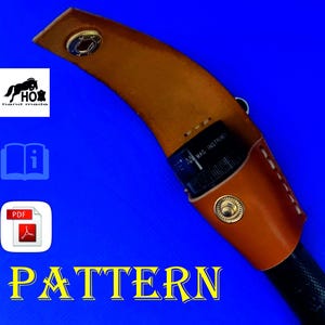May include: A brown leather holster with stitching and a gold snap closure. The holster is designed to fit a small flashlight with a black metal body and a silver dial. The text "LE MAG INSTRUME" is visible on the flashlight.