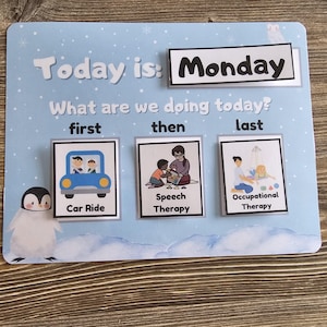 May include: A visual schedule for a child's day, with a blue background and a penguin illustration. The schedule shows the day is Monday, and the activities are a car ride, speech therapy, and occupational therapy.