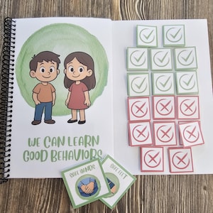 May include: An open spiral-bound book with the text "WE CAN LEARN GOOD BEHAVIORS" and illustrations of a boy and girl. There are also green and red square cards with check marks and crosses, and two cards that say "SAFE HANDS" and "SAFE FEET".