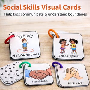 May include: A set of square social skills visual cards with colorful rings. The cards feature illustrations and text such as "My Body," "I need space," "Handshake," and "High Five." The text "Social Skills Visual Cards" is at the top.