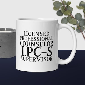 May include: White ceramic coffee mug with black text that reads "Licensed Professional Counselor LPC-S Supervisor".
