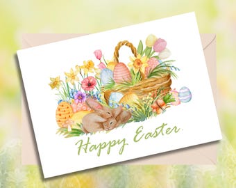 Pode incluir: Uma ilustração em aquarela de uma cesta cheia de ovos de Páscoa coloridos, cercada por flores e dois coelhos marrons. O texto "Feliz Páscoa" está escrito em verde abaixo da cesta.